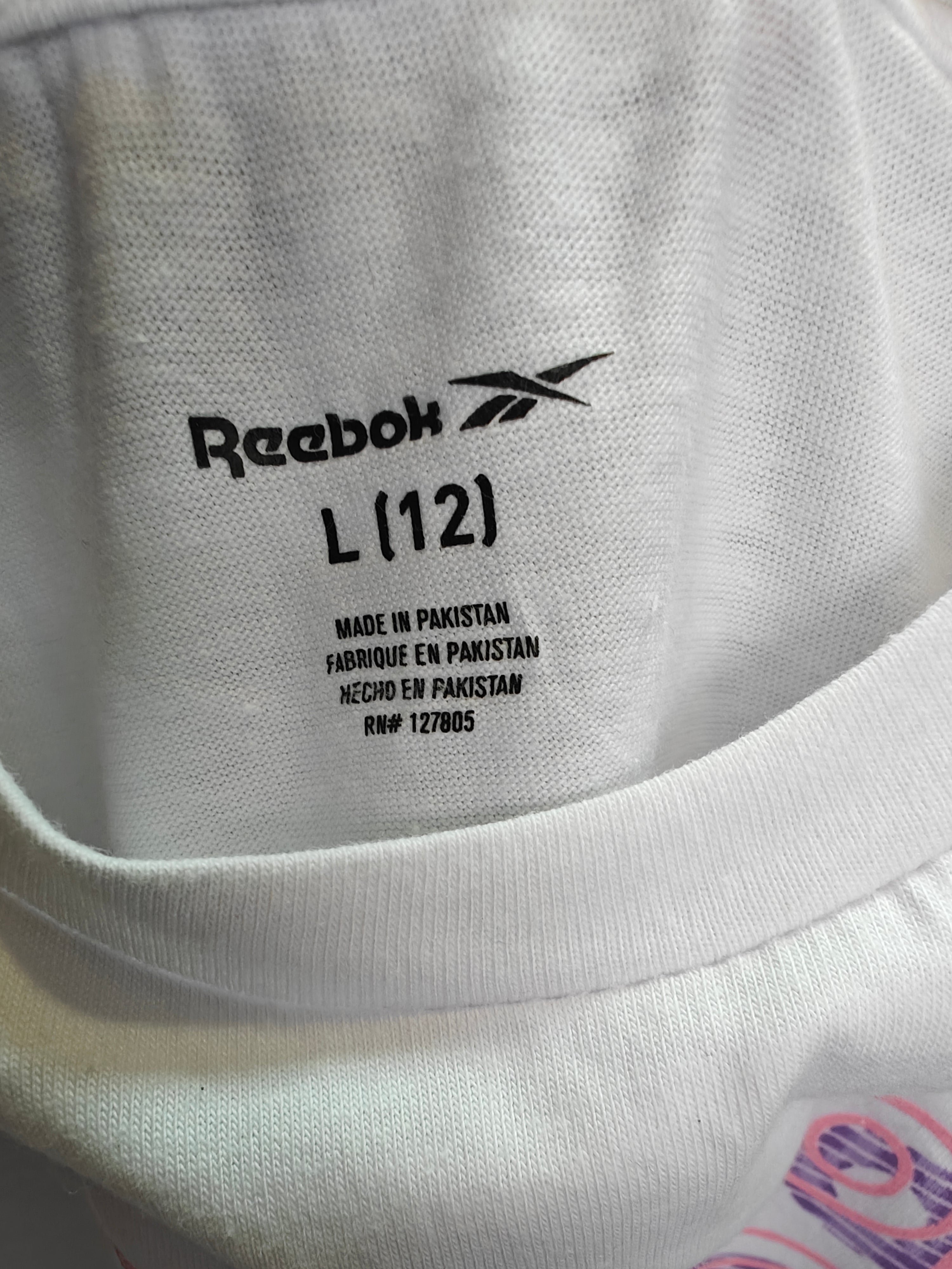 Polera Reebok Girl’s – Blanco con Logotipo Rosa y Morado